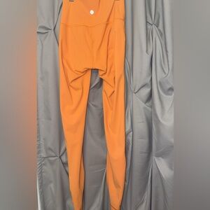 orange Lululemon leggings barley worn maybe once size 2